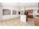 Open kitchen with tile flooring, stainless appliances, granite countertops, and ample cabinet space at 4520 N 151St Dr, Goodyear, AZ 85395