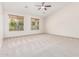 Spacious main bedroom with high ceilings, large windows, and plush carpeting at 4520 N 151St Dr, Goodyear, AZ 85395