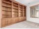 Charming office space with a built-in bookcase and a window providing natural light at 4520 N 151St Dr, Goodyear, AZ 85395