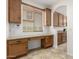 Office nook with granite countertop desk, cabinets and large window at 4520 N 151St Dr, Goodyear, AZ 85395