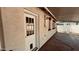 Side of a single Gathering home showing back door under covered patio and stucco exterior at 461 N Cheri Lynn Dr, Chandler, AZ 85225