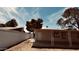 Backyard of a charming single-story home with a patio area, partial fencing, and mature trees at 461 N Cheri Lynn Dr, Chandler, AZ 85225