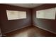 Cozy bedroom with tiled floor gets ample natural light from two windows, creating a warm atmosphere at 461 N Cheri Lynn Dr, Chandler, AZ 85225