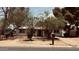 Charming single-story home with a well-maintained front yard and mature trees at 461 N Cheri Lynn Dr, Chandler, AZ 85225