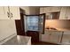 Stainless steel fridge and sink compliment the white cabinets and create an efficient cooking space at 461 N Cheri Lynn Dr, Chandler, AZ 85225