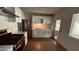 Updated kitchen features white cabinets, stainless steel appliances, and stone countertops at 461 N Cheri Lynn Dr, Chandler, AZ 85225