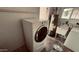 Well-equipped laundry room with modern washer and dryer, water heater, and storage sink at 461 N Cheri Lynn Dr, Chandler, AZ 85225