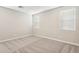 Bright bedroom featuring two windows and carpeted floors at 5815 E Covey Ln, Phoenix, AZ 85054
