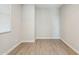 Bedroom featuring a window and wood-style tile flooring at 5815 E Covey Ln, Phoenix, AZ 85054