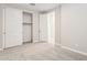 Neutral bedroom featuring carpeted floors, closet, and an open doorway at 5815 E Covey Ln, Phoenix, AZ 85054