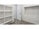 Walk-in closet with rod and shelves at 5815 E Covey Ln, Phoenix, AZ 85054