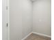 Small mud room with wood-style tile flooring and an electrical outlet at 5815 E Covey Ln, Phoenix, AZ 85054