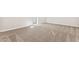 Bright bedroom boasts neutral walls, plush carpeting, and doorway to ensuite bathroom at 5819 E Covey Ln, Phoenix, AZ 85054