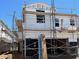 New home under construction, showcasing the exterior framing and scaffolding at 5819 E Covey Ln, Phoenix, AZ 85054
