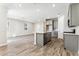 Spacious kitchen and living area with wood-look flooring and ample natural light at 5819 E Covey Ln, Phoenix, AZ 85054