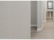 The hallway has hard surface flooring and textured walls at 5831 E Covey Ln, Phoenix, AZ 85054