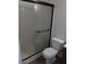Bathroom with a toilet and a shower with sliding glass doors at 6029 N 31St Ave, Phoenix, AZ 85017