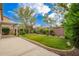 Lush backyard with green grass, mature trees, and a concrete patio area, perfect for outdoor entertaining at 6300 S Nash Way, Chandler, AZ 85249