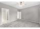 Large bedroom featuring neutral paint, ceiling fan, and access to attached bathroom at 6300 S Nash Way, Chandler, AZ 85249