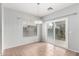 Cozy dining area with tiled flooring, chandelier, and access to the backyard via sliding glass doors at 6300 S Nash Way, Chandler, AZ 85249