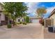 Charming single-story home features a long driveway and meticulously manicured front yard at 6300 S Nash Way, Chandler, AZ 85249