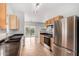 Well-lit kitchen with stainless steel appliances and granite countertops at 6300 S Nash Way, Chandler, AZ 85249
