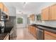 Spacious kitchen features stainless steel appliances and views to breakfast nook at 6300 S Nash Way, Chandler, AZ 85249