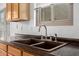 Close up view of kitchen sink, with granite countertops and stainless steel faucet at 6300 S Nash Way, Chandler, AZ 85249
