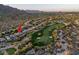 Stunning aerial view of property on the golf course with mountain views at 6481 E Amber Sun Dr, Scottsdale, AZ 85266