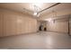 Spacious garage with ample storage cabinets and epoxy flooring, providing functionality and organization at 6481 E Amber Sun Dr, Scottsdale, AZ 85266