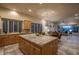 Bright kitchen featuring a tile island that flows into the dining and living areas at 6481 E Amber Sun Dr, Scottsdale, AZ 85266