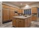 Spacious kitchen island and custom cabinetry perfect for culinary enthusiasts at 6481 E Amber Sun Dr, Scottsdale, AZ 85266