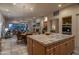Gourmet kitchen with a large island, modern appliances, and seamless access to living spaces at 6481 E Amber Sun Dr, Scottsdale, AZ 85266