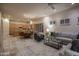 Open-concept living room showcasing a modern kitchen, cozy seating, and stylish decor at 6481 E Amber Sun Dr, Scottsdale, AZ 85266