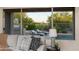 Bright living space with a view of the backyard, featuring a pool and outdoor kitchen at 6481 E Amber Sun Dr, Scottsdale, AZ 85266