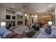 Open-concept living area with fireplace flows into the kitchen with eat-in dining at 6481 E Amber Sun Dr, Scottsdale, AZ 85266