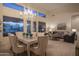 Open-concept living and dining area with chandelier and lots of light at 6481 E Amber Sun Dr, Scottsdale, AZ 85266