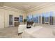 Tranquil main bedroom with plush seating, custom built-ins, and abundant natural light at 6481 E Amber Sun Dr, Scottsdale, AZ 85266