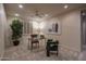 Home office with neutral walls, a ceiling fan, and large window with plantation shutters, perfect for working from home at 6481 E Amber Sun Dr, Scottsdale, AZ 85266