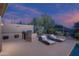 Outdoor kitchen and lounge chairs create a perfect space for outdoor entertaining and relaxation at 6481 E Amber Sun Dr, Scottsdale, AZ 85266