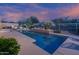 Beautiful pool with water feature and desert landscaping at 6481 E Amber Sun Dr, Scottsdale, AZ 85266