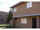Modest two-story exterior with a quaint front lawn and views from the upper-level windows at 6911 W Devonshire Ave # 1269, Phoenix, AZ 85033