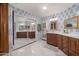 The bathroom features an ensuite, double vanities, and stylish patterned wallpaper at 8219 S Pecan Grove Cir, Tempe, AZ 85284