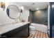 Bathroom featuring a vanity with marble countertop and shower-tub combo at 8219 S Pecan Grove Cir, Tempe, AZ 85284