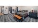 Well-lit bedroom with plaid carpet, sports themed decor, and en-suite bathroom at 8219 S Pecan Grove Cir, Tempe, AZ 85284