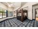 Bedroom featuring bunk beds, large windows, and stylish plaid carpet at 8219 S Pecan Grove Cir, Tempe, AZ 85284