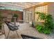 Relaxing courtyard with pergola, string lights, water feature, lush greenery, and outdoor seating at 8219 S Pecan Grove Cir, Tempe, AZ 85284