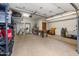 Spacious garage with lots of storage and a workbench at 8219 S Pecan Grove Cir, Tempe, AZ 85284