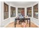 Bright home office featuring hardwood floors, bay windows and designer accents at 8219 S Pecan Grove Cir, Tempe, AZ 85284
