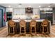 This gourmet kitchen features a large center island, custom cabinetry, and marble countertops at 8219 S Pecan Grove Cir, Tempe, AZ 85284